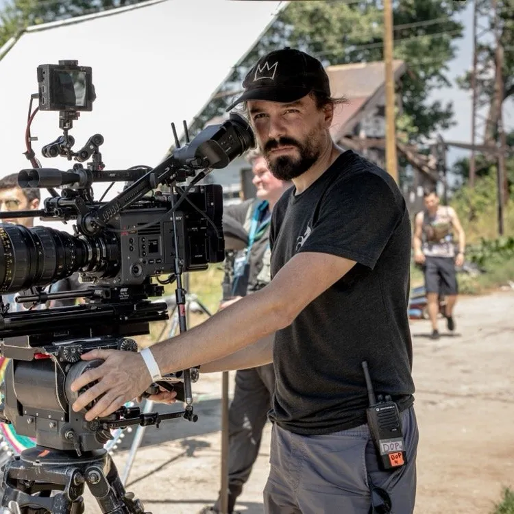 Zach Kuperstein with a cinema camera on set